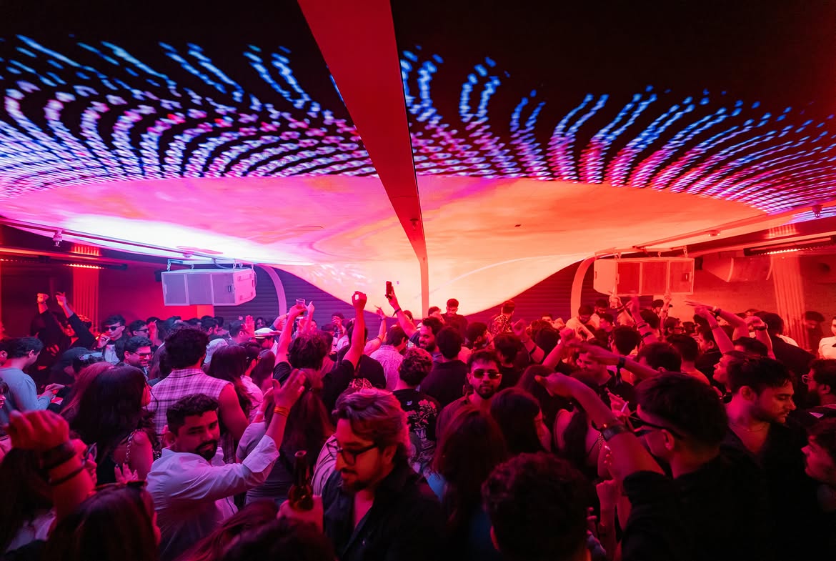 A full floor beneath the lit ceiling